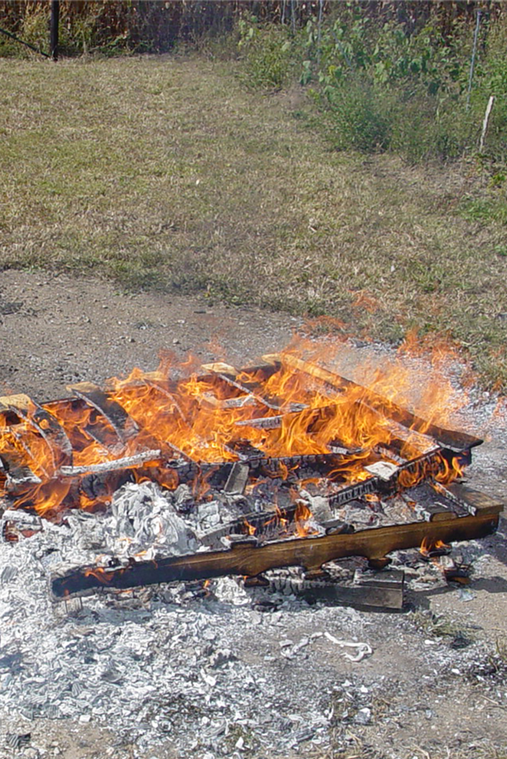 Burning trash, like this pallet, creates significant health risks  |  Iowa DNR